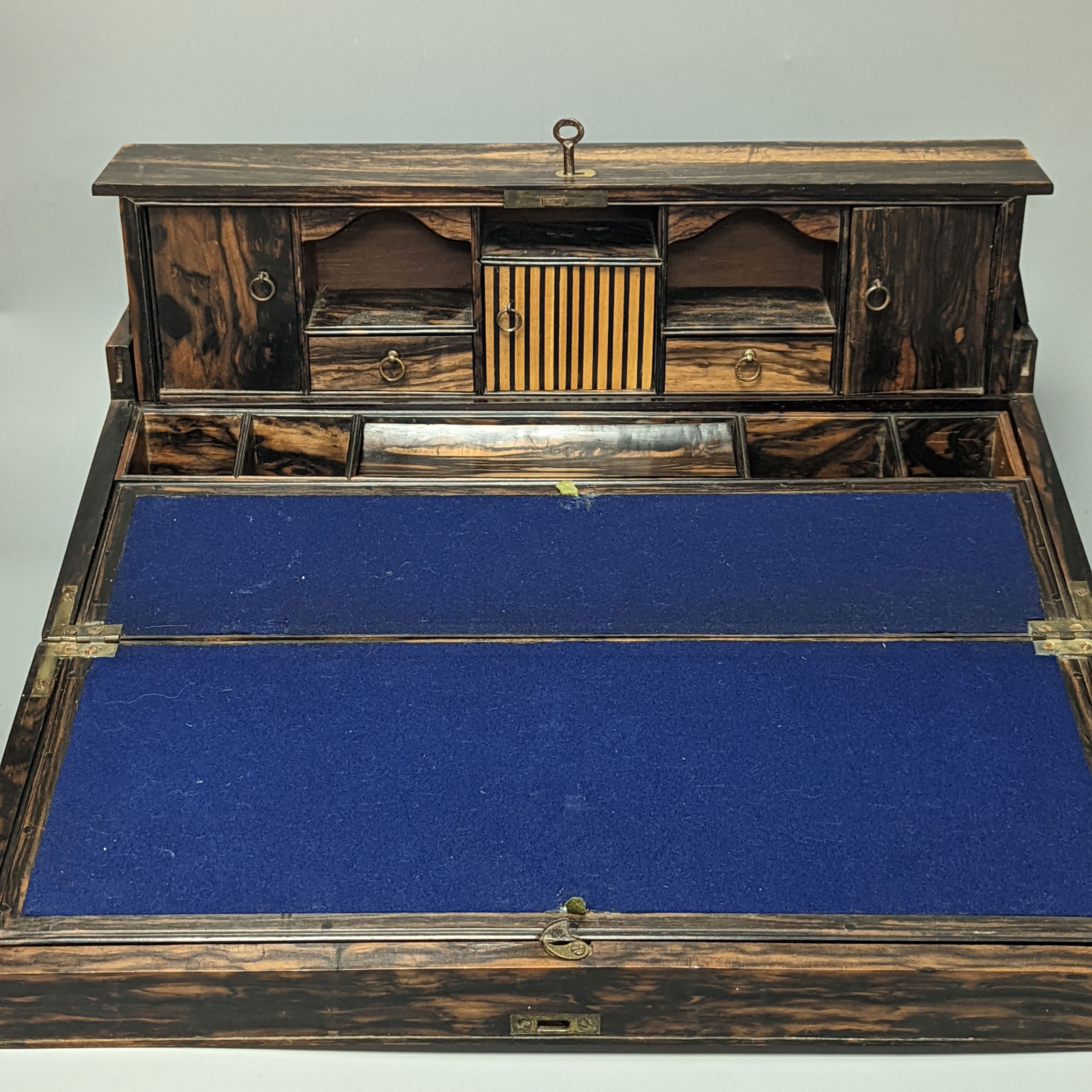 A 19th Anglo-Indian coromandel writing slope, with harlequin action compartmentalised superstructure, 45cm wide